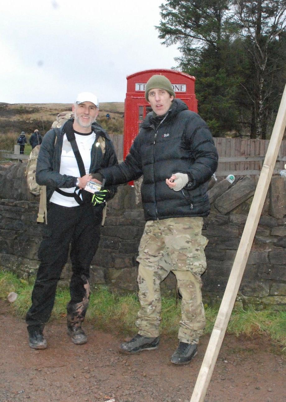 Andrew receiving his patch from an SAS Soldier after completing the Fan Dance